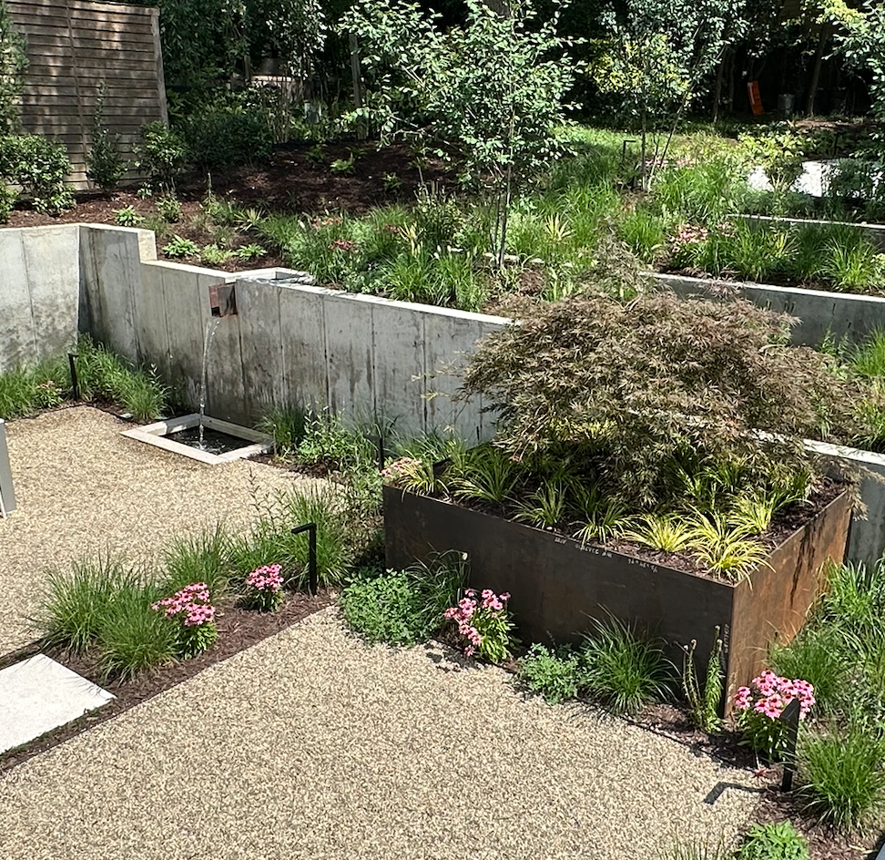 Planter and fountain in the same backyard